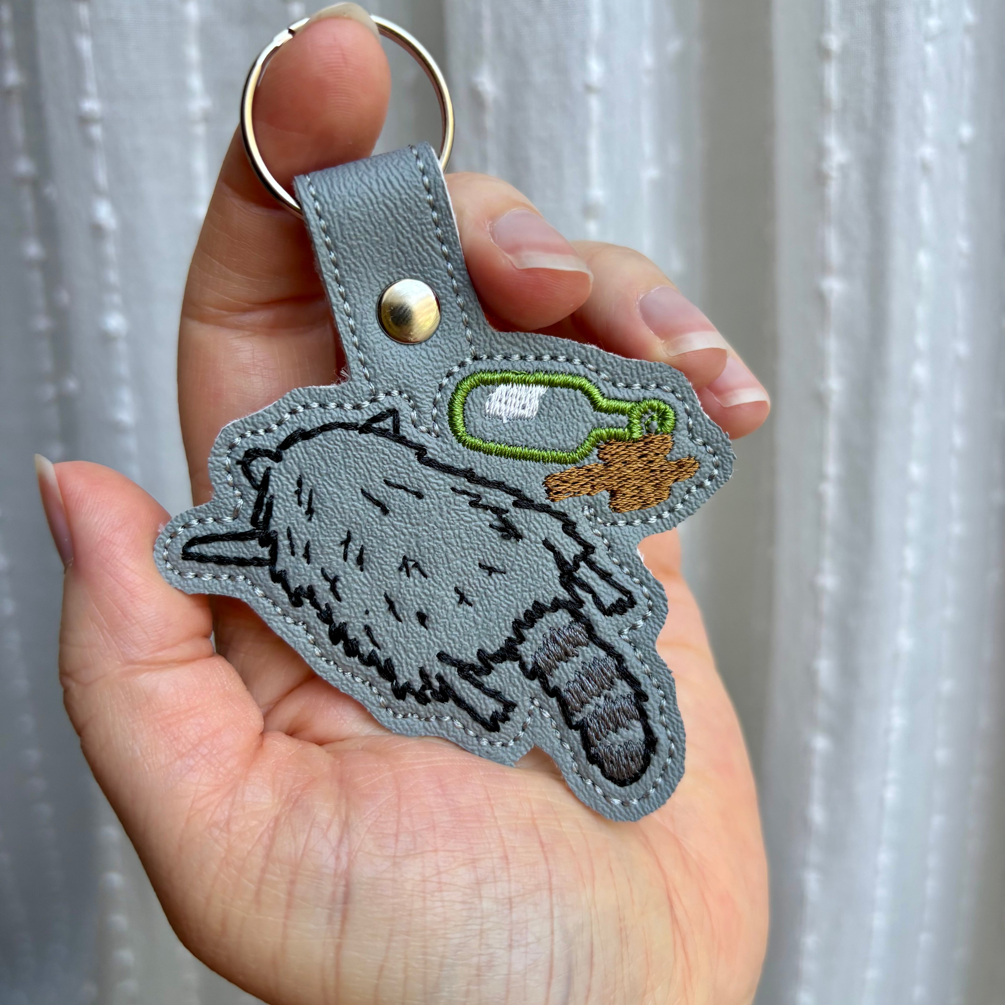 Drunk Raccoon Keychain