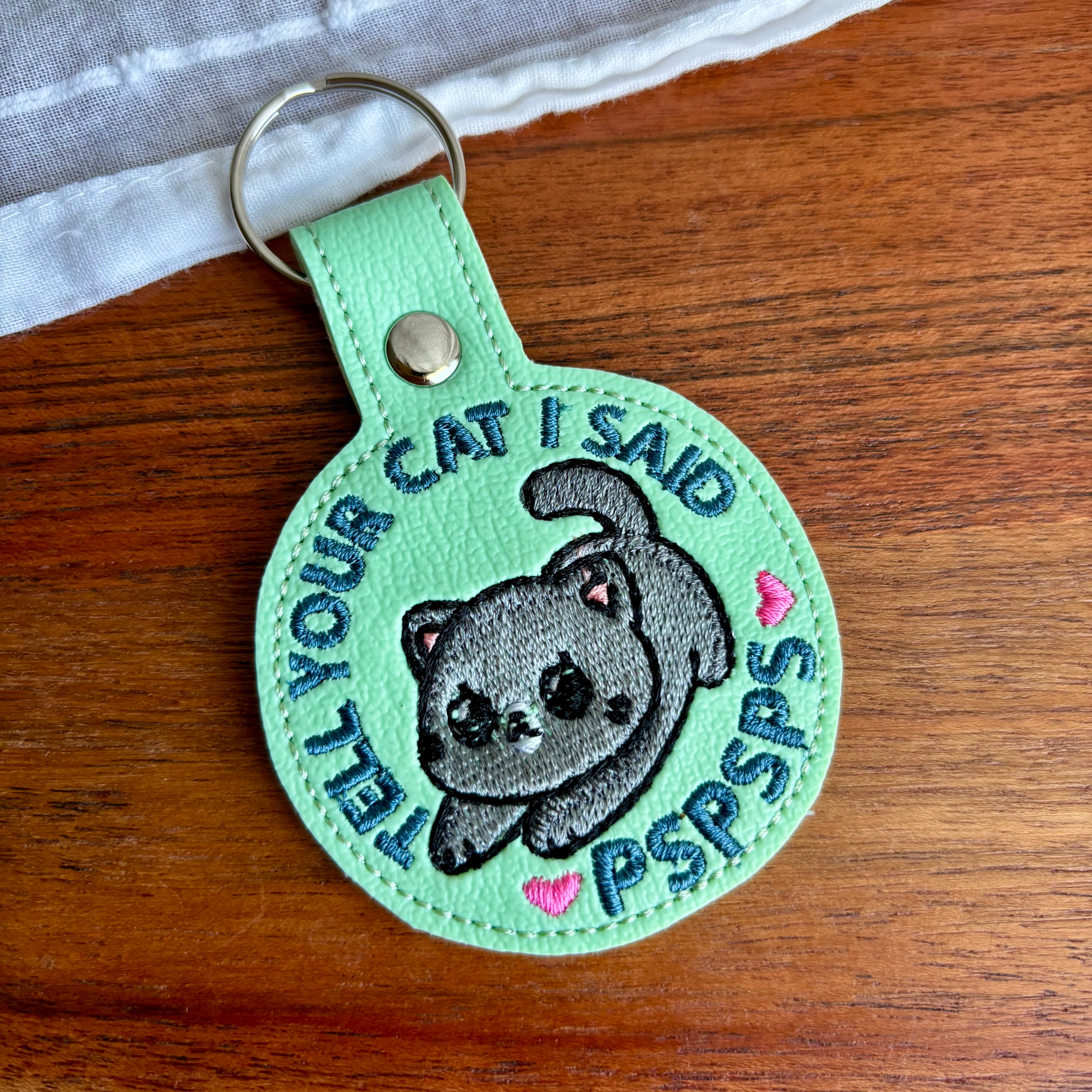 Tell Your Cat Keychain